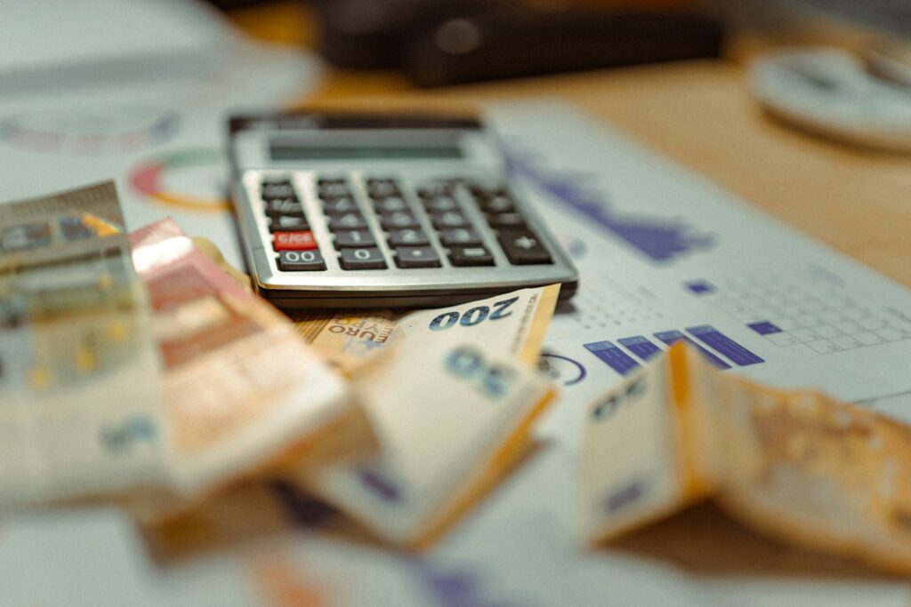 true cost of hiring in korea - payroll document with calculator and won currency
